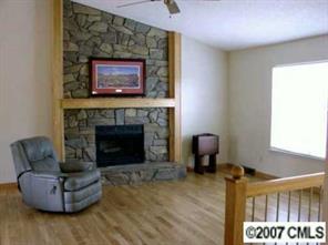 9918 Fairway Ridge Road Charlotte, NC 28277 - Photo 4 of 5 a living room with furniture and a fireplace