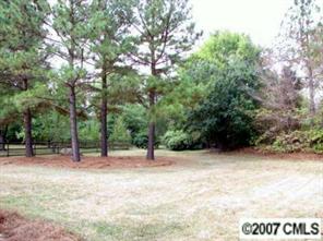 9918 Fairway Ridge Road Charlotte, NC 28277 - Photo 5 of 5 a view of outdoor space with deck and trees