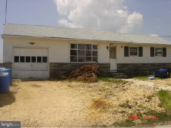 112 East Mullica Road Tuckerton, NJ 08087 - Photo 1 of 6 a front view of a house with a yard