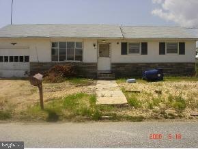 112 East Mullica Road Tuckerton, NJ 08087 - Photo 2 of 6 a front view of a house with a yard