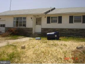 112 East Mullica Road Tuckerton, NJ 08087 - Photo 3 of 6 a front view of a house with a yard