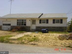 112 East Mullica Road Tuckerton, NJ 08087 - Photo 4 of 6 a front view of a house with a yard