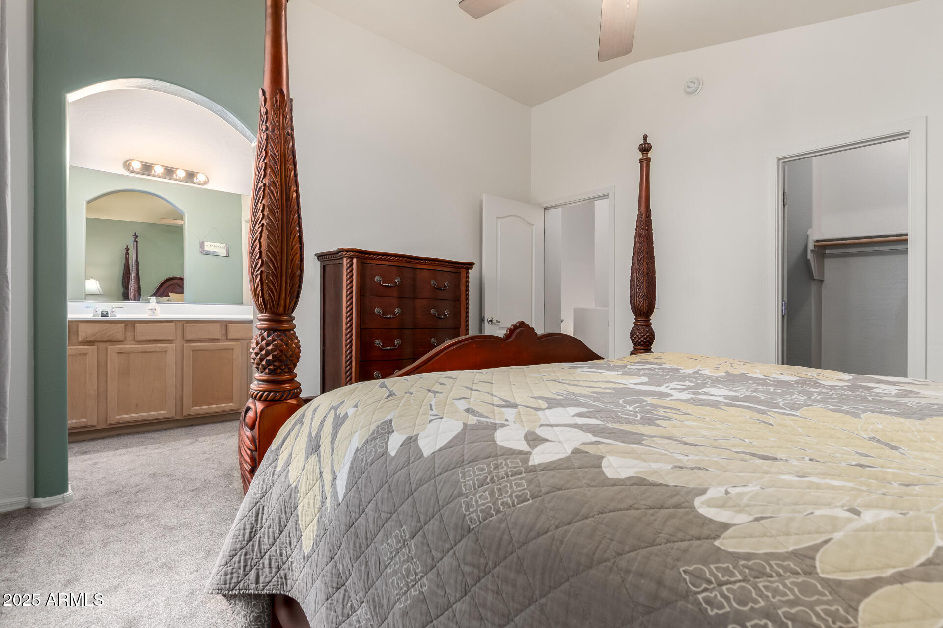 2024 South Baldwin, Unit 99 Mesa, AZ 85209 - Photo 13 of 78 a bedroom with a bed and a chandelier