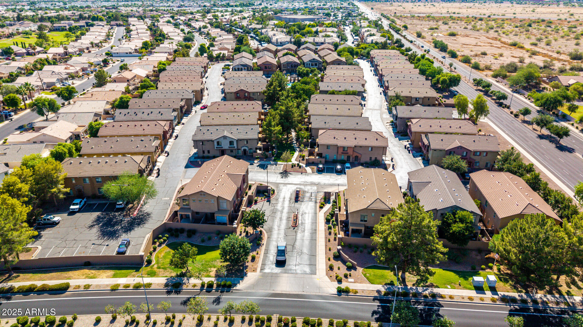 2024 South Baldwin, Unit 99 Mesa, AZ 85209 - Photo 35 of 78 an aerial view of multiple houses with yard