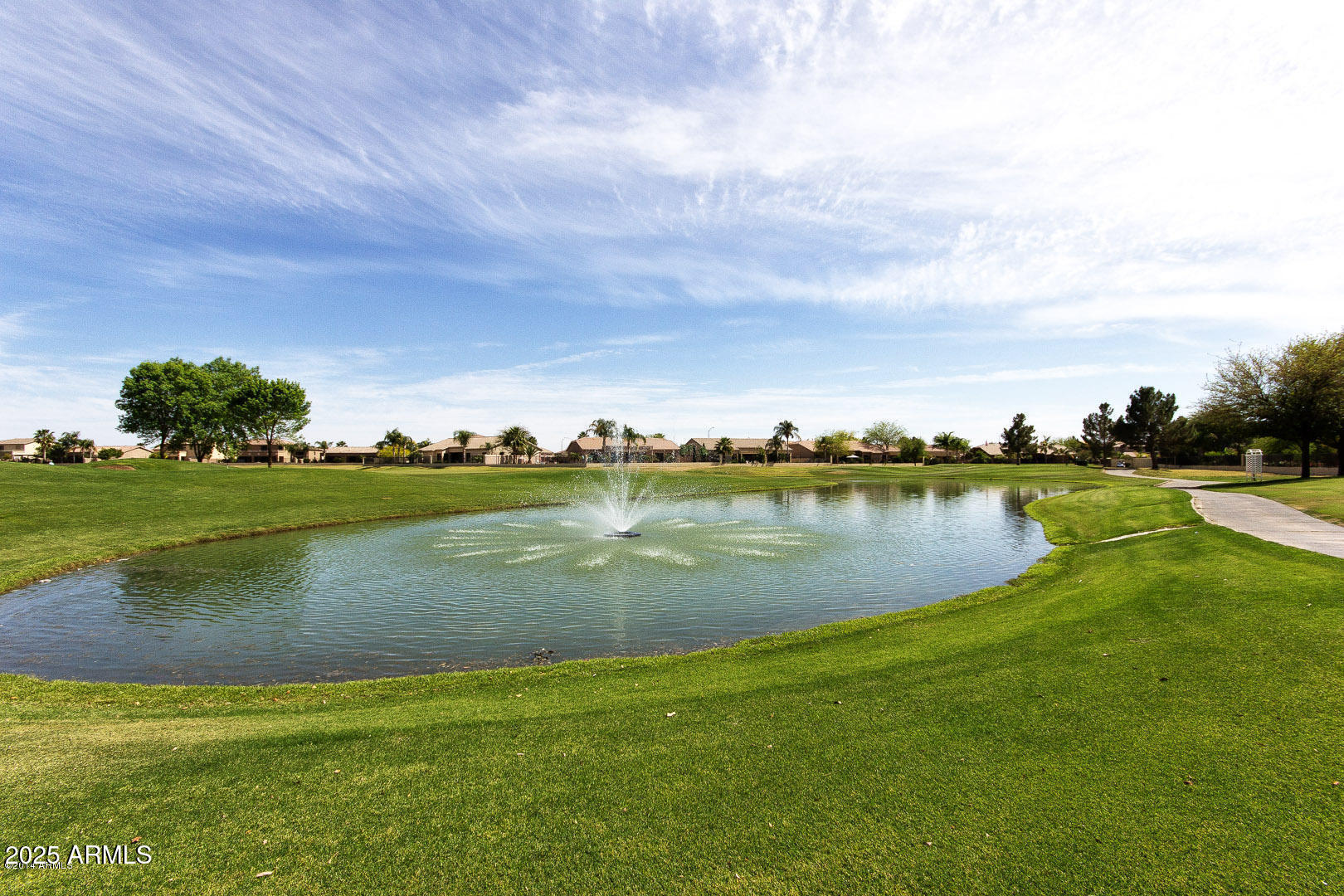 2024 South Baldwin, Unit 99 Mesa, AZ 85209 - Photo 58 of 78 a view of a lake with houses in the background