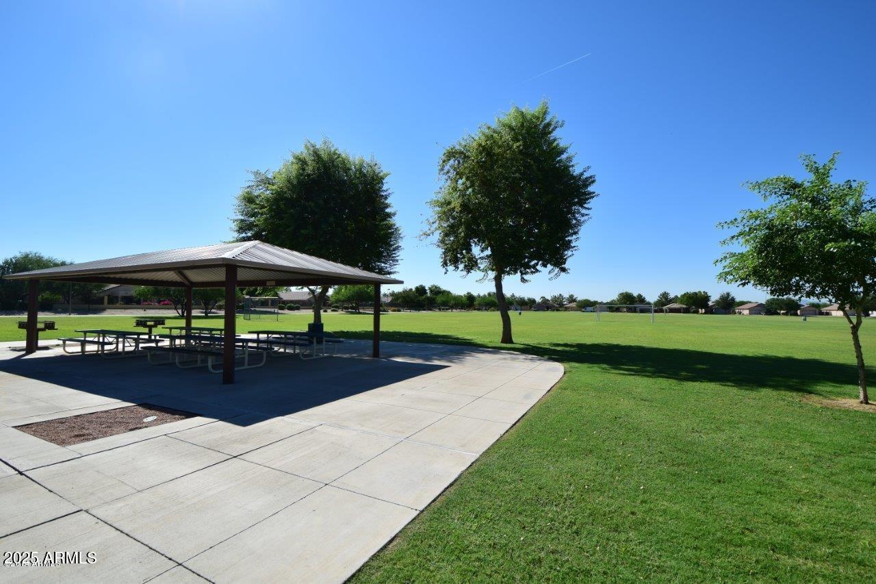 2024 South Baldwin, Unit 99 Mesa, AZ 85209 - Photo 62 of 78 a view of a swimming pool and lounge chairs in the patio