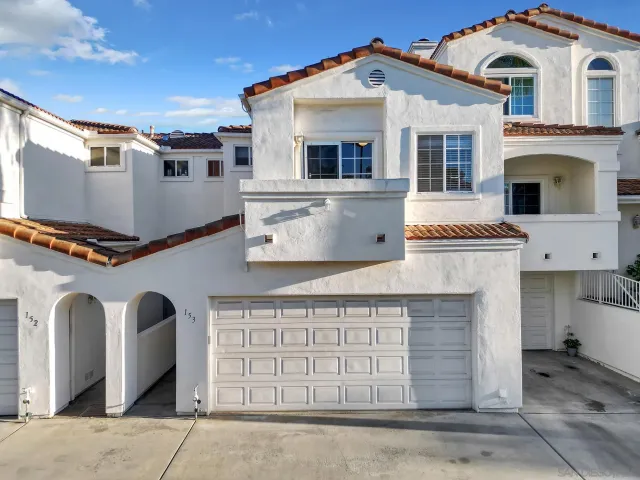 a front view of a house with a garage