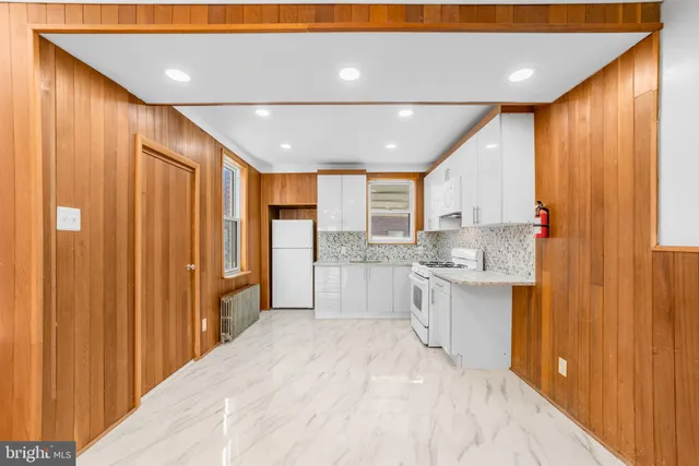 a large kitchen with a large window