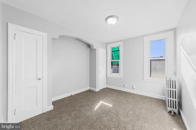 an empty room with windows