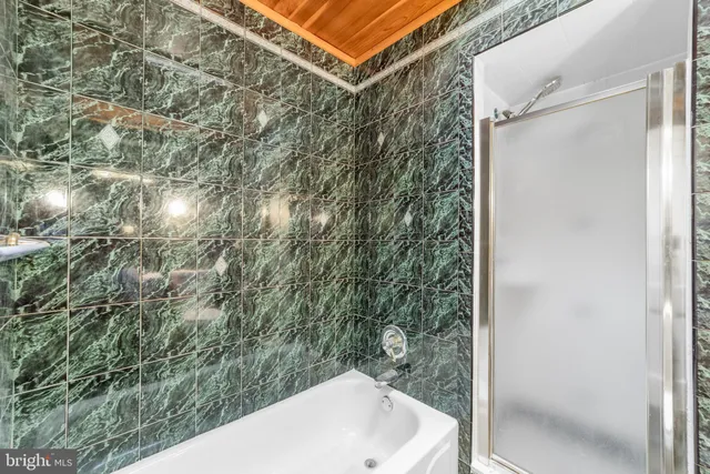 a bathroom with a bathtub and sink