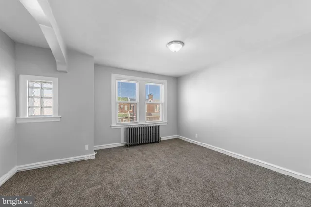 an empty room with windows