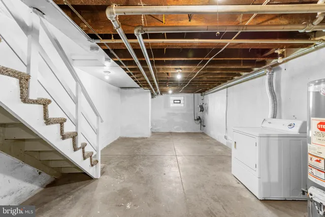 a view of storage and utility room with stairs