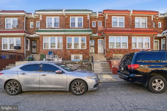 a car parked in front of a house