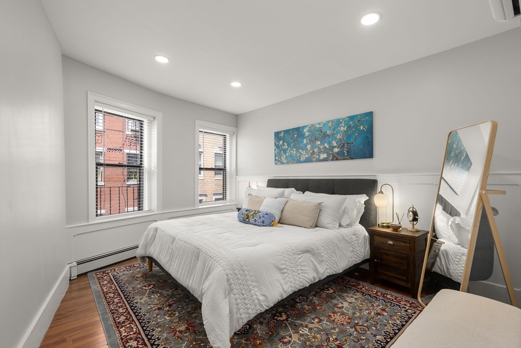 165 Salem Street, Unit 3 Boston, MA 02113 - Photo 14 of 16 a bedroom with a bed a couch and a window