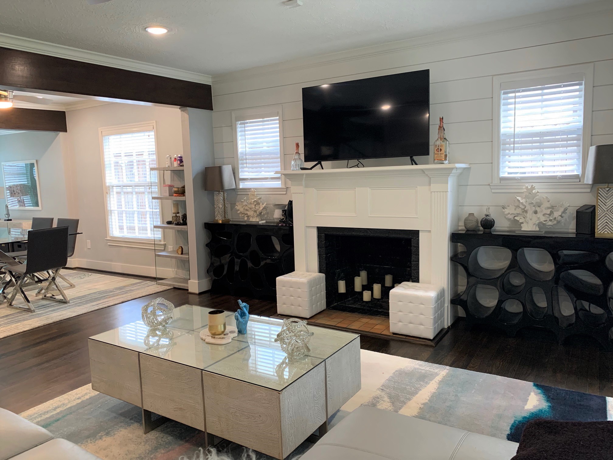 3909 Rice Boulevard Houston, TX 77005 - Photo 3 of 17 a living room with furniture a fireplace and a flat screen tv