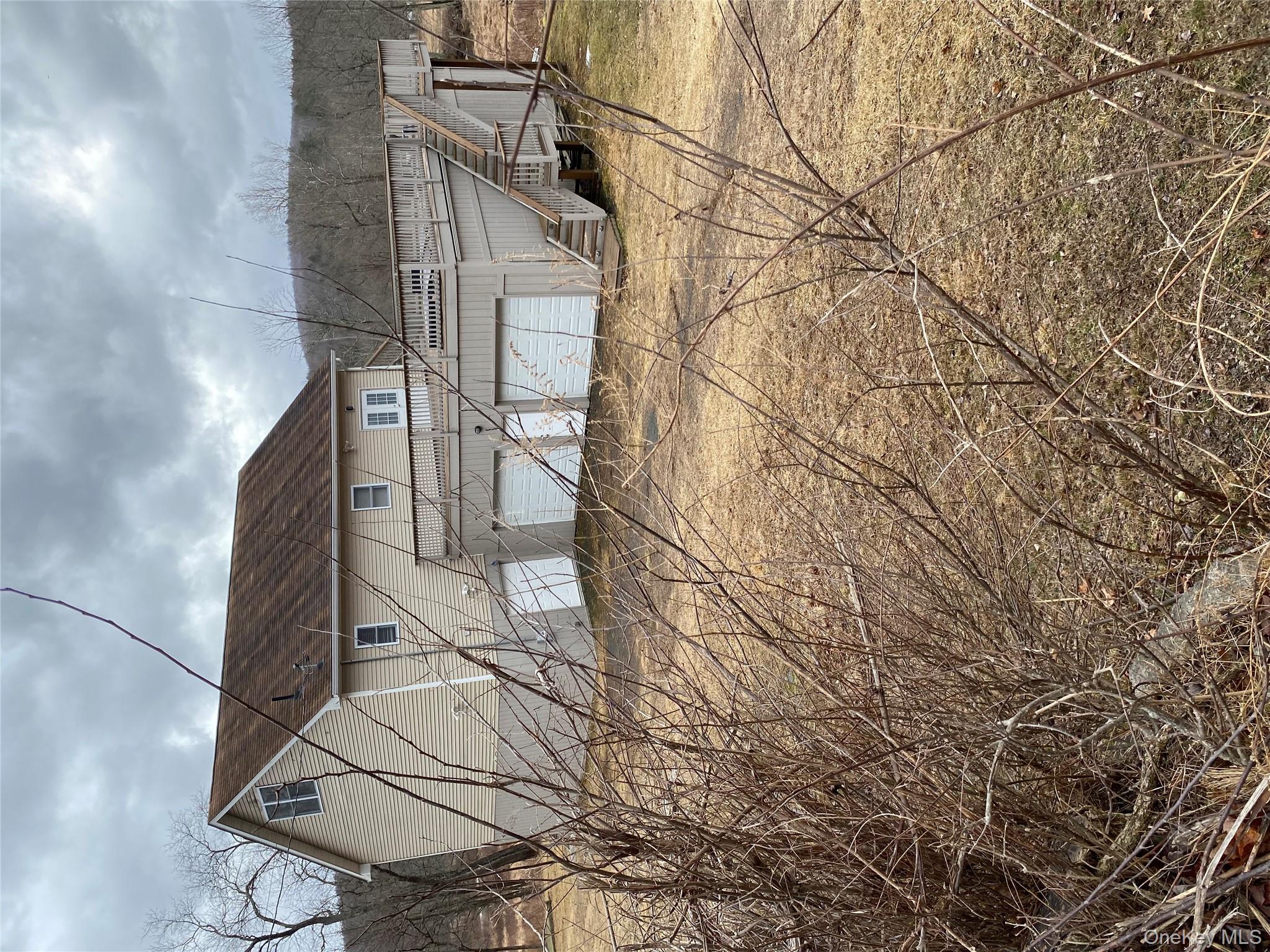 a view of a house with backyard