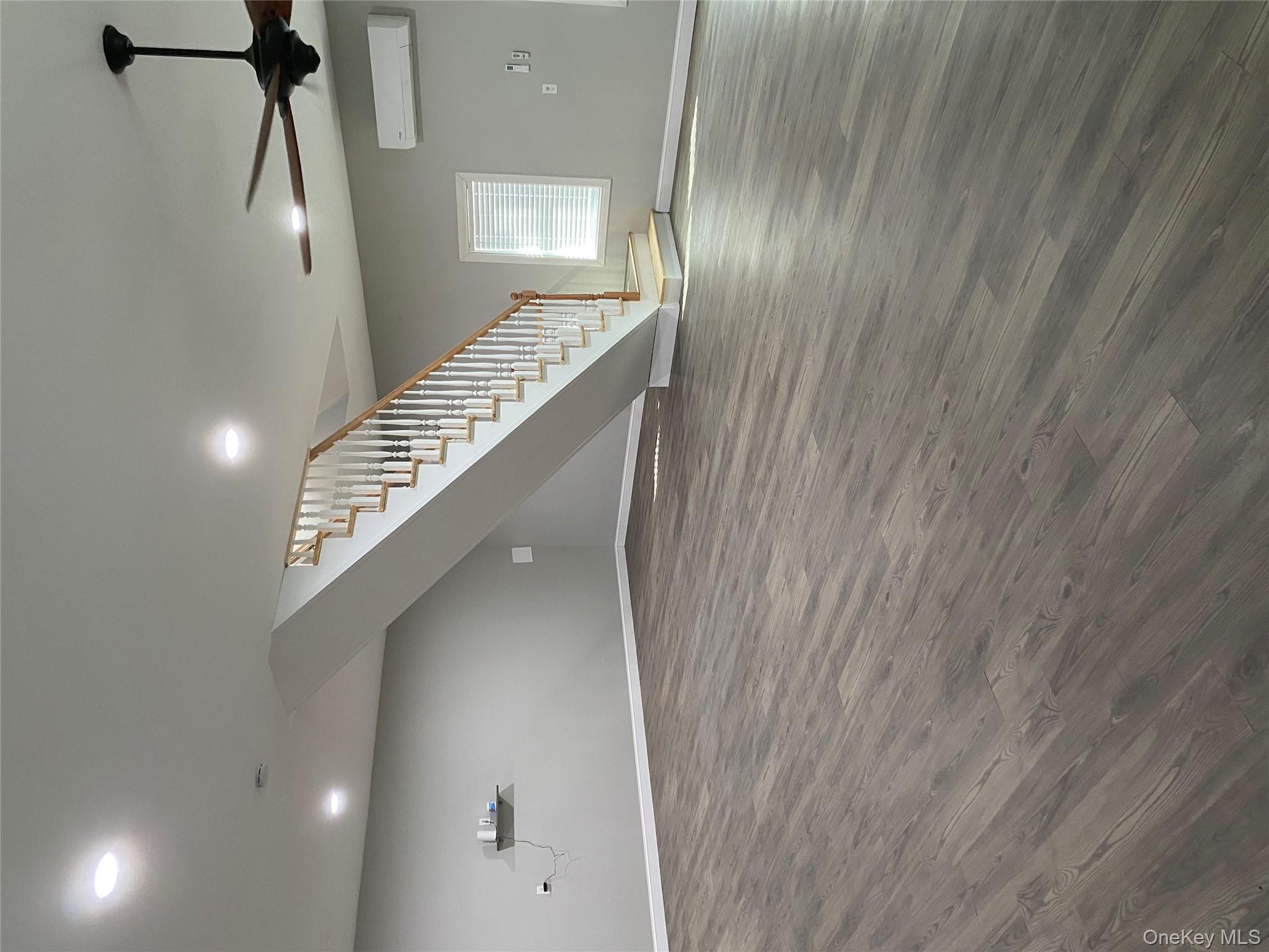 325 Hasbrouck Road Woodbourne, NY 12788 - Photo 11 of 14 a view of an empty room with wooden floor