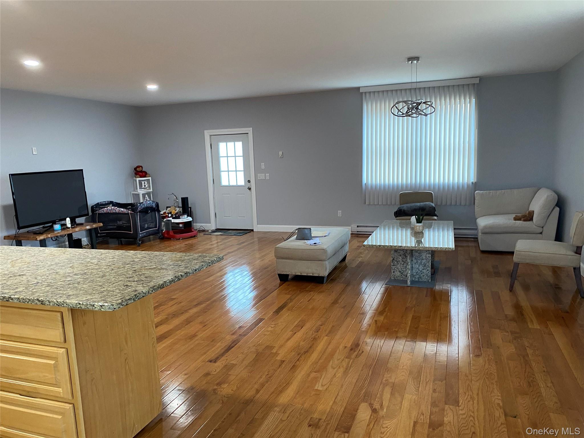 325 Hasbrouck Road Woodbourne, NY 12788 - Photo 2 of 14 a living room with furniture and a wooden floor