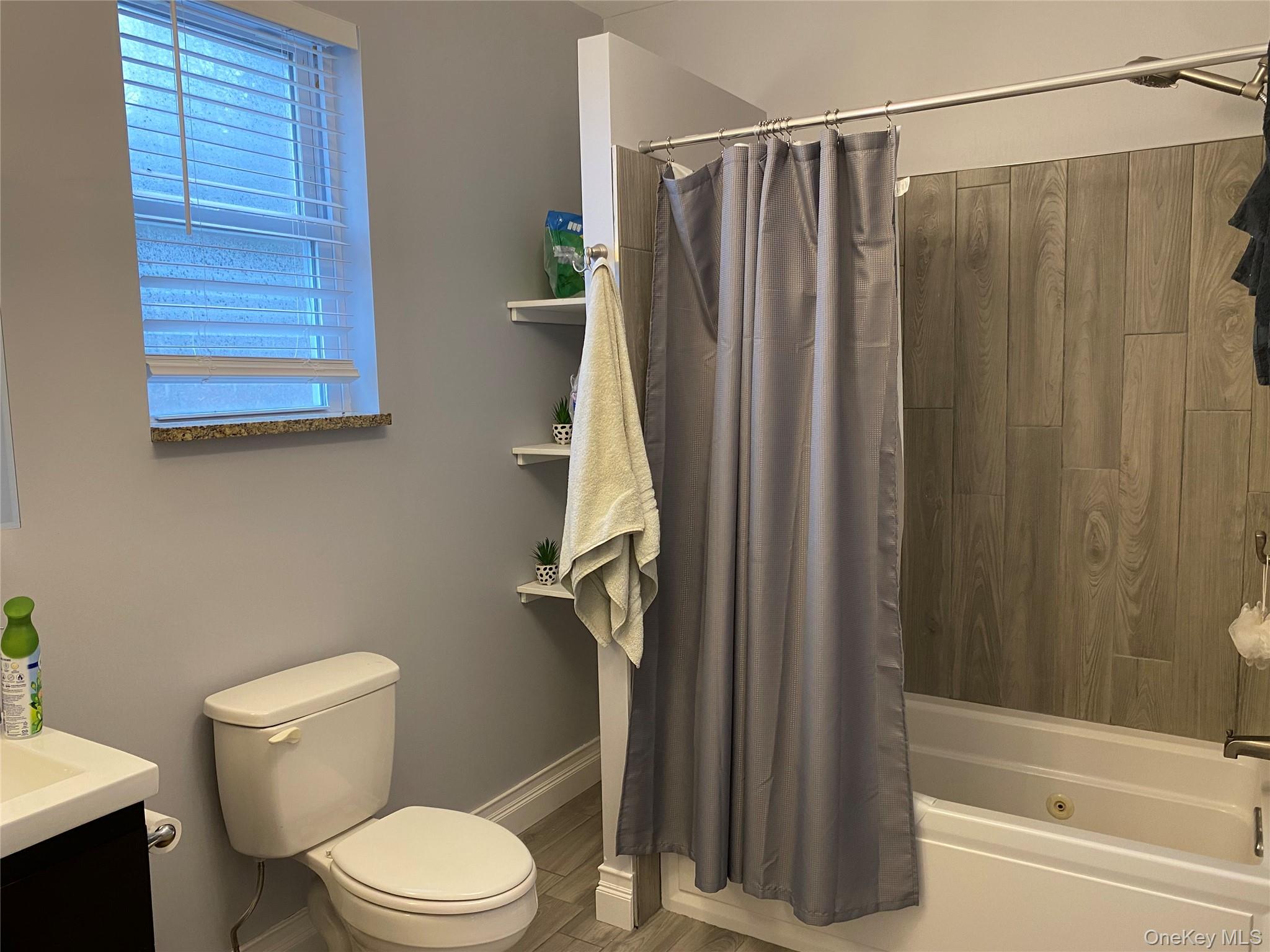 325 Hasbrouck Road Woodbourne, NY 12788 - Photo 6 of 14 a white toilet sitting next to a bath tub