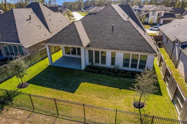 a aerial view of a house with swimming pool