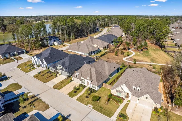 a view of a patio with table and chairs under an umbrella