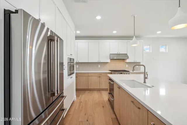 a bathroom with a bathtub sink and mirror