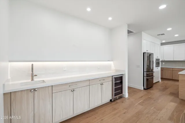 a kitchen with sink and cabinets