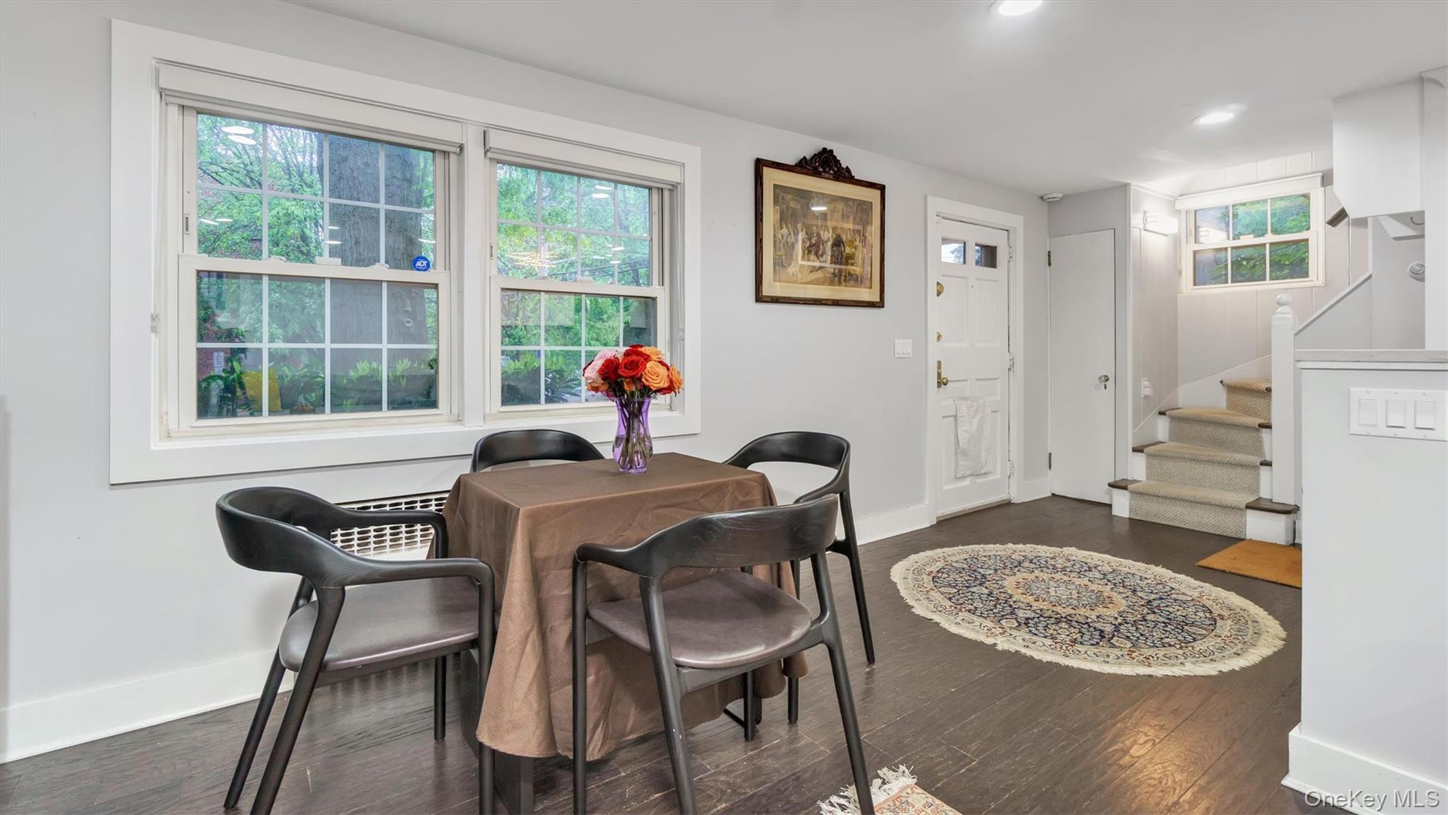 19 Barstow Road, Unit G Great Neck, NY 11021 - Photo 20 of 36 a living room with furniture and a table