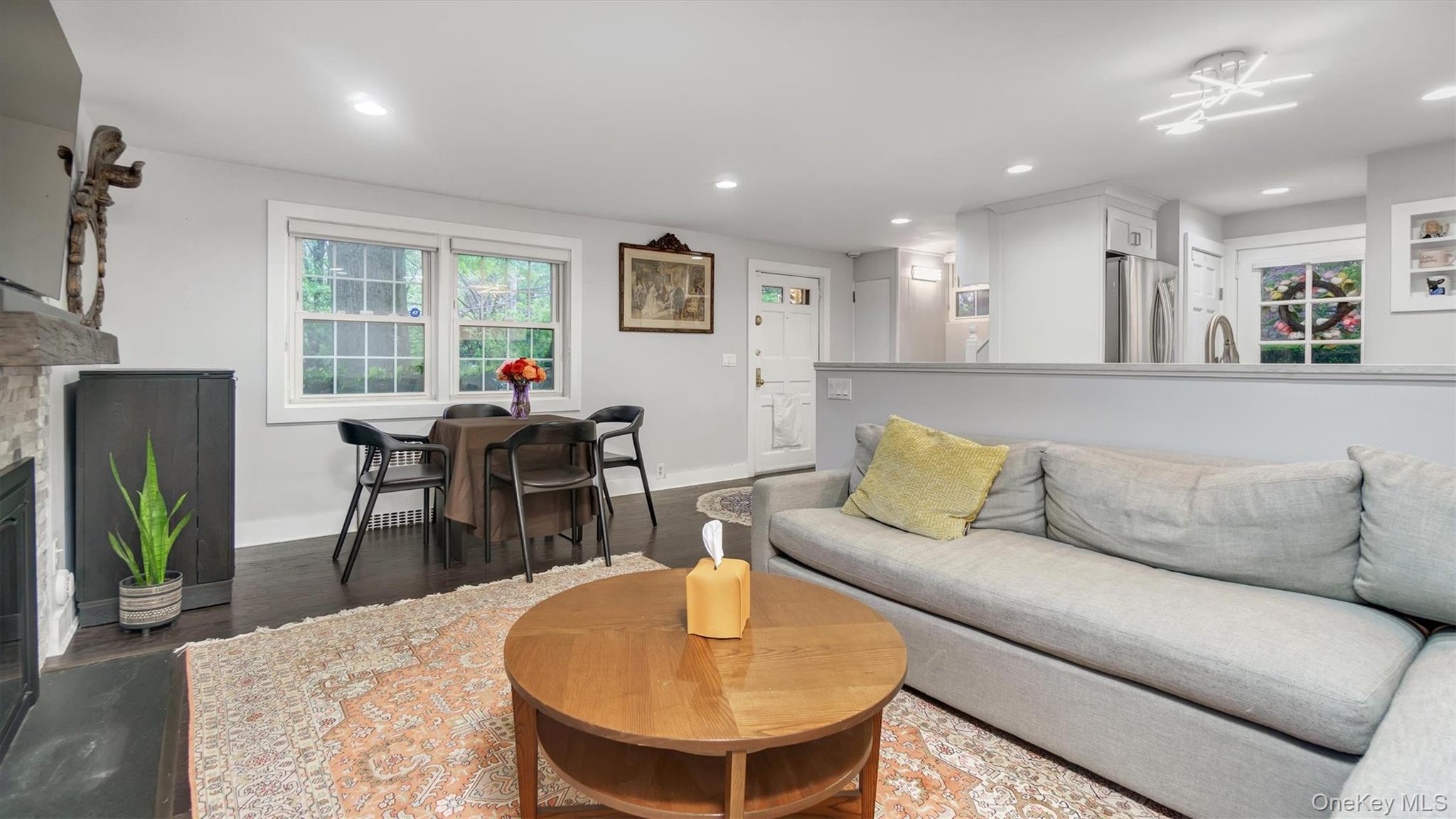 19 Barstow Road, Unit G Great Neck, NY 11021 - Photo 21 of 36 a living room with furniture and a wooden floor