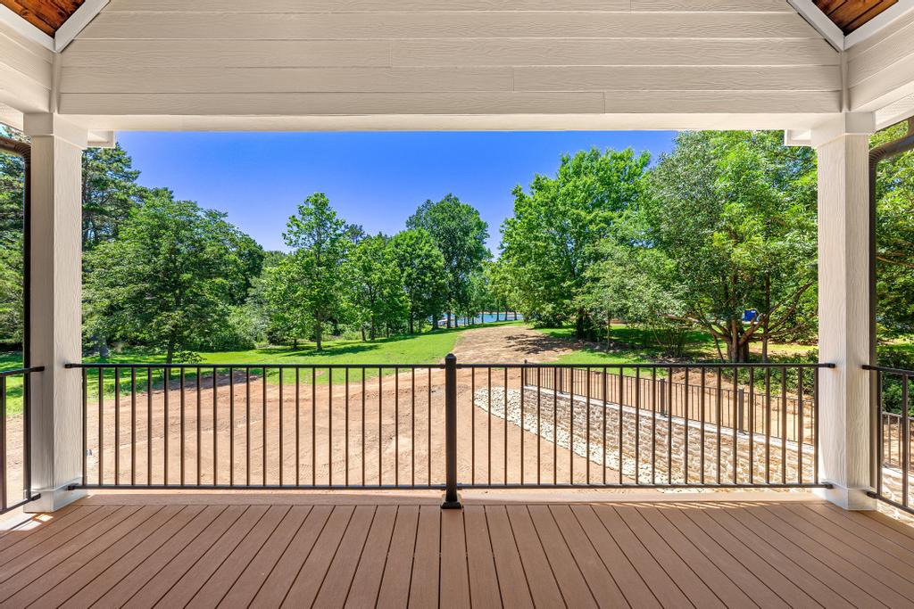 707 Vickery Street Extension Hartwell, GA 30643 - Photo 16 of 50 Unwind on this welcoming covered deck, enjoying verdant scenery and distant waters.