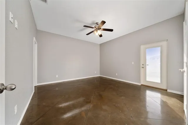 a bathroom with a granite countertop sink toilet and mirror