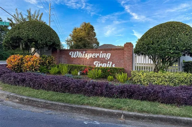 a sign board with a house