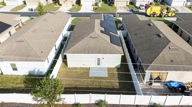 a view of a kitchen with a sink and a refrigerator