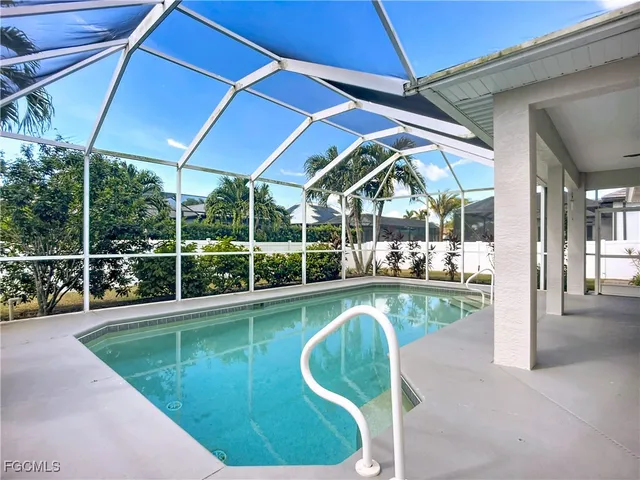 a view of a swimming pool with a porch