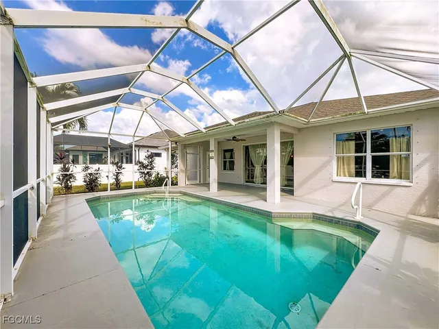 a view of a swimming pool with a patio