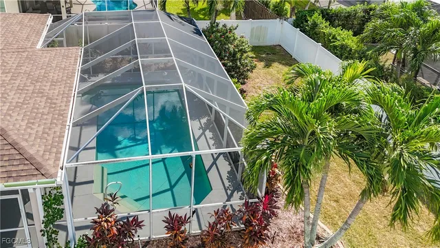 an aerial view of house with yard