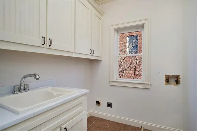 a bathroom with a sink and cabinets