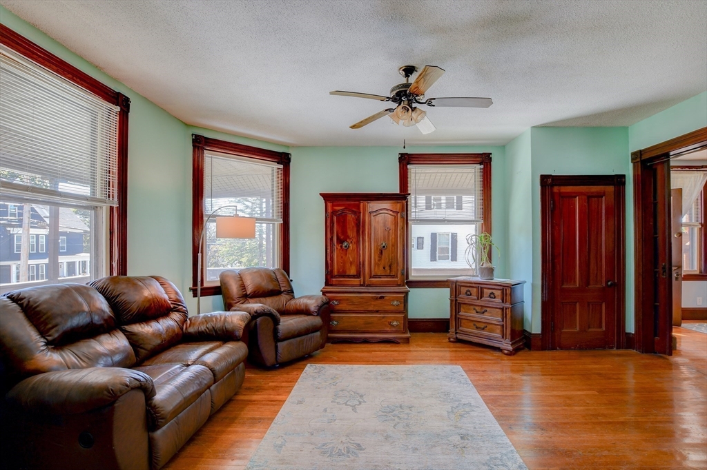 120 Graham Street Gardner, MA 01440 - Photo 12 of 37 a living room with fireplace furniture and a window