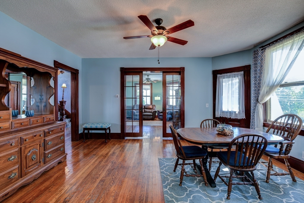 120 Graham Street Gardner, MA 01440 - Photo 19 of 37 a dining room with furniture a chandelier and wooden floor