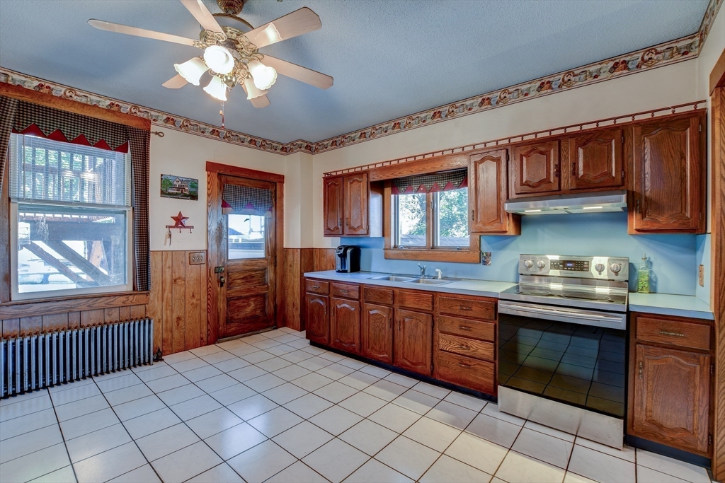 120 Graham Street Gardner, MA 01440 - Photo 23 of 37 a kitchen with stainless steel appliances granite countertop a stove sink and cabinets