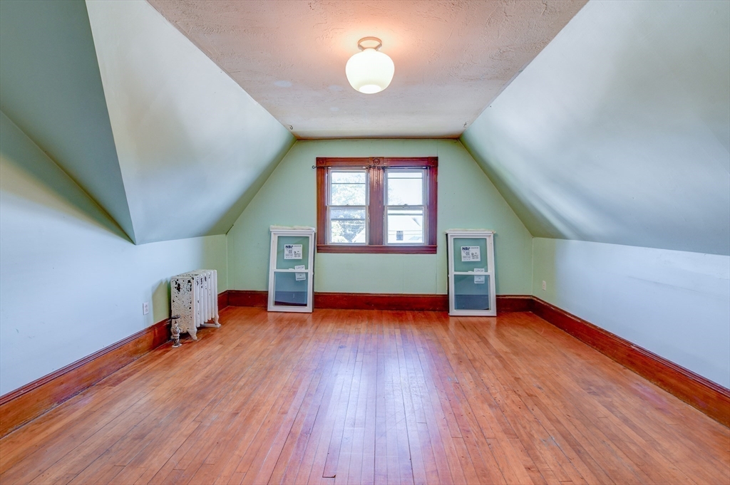 120 Graham Street Gardner, MA 01440 - Photo 31 of 37 an empty room with wooden floor and windows
