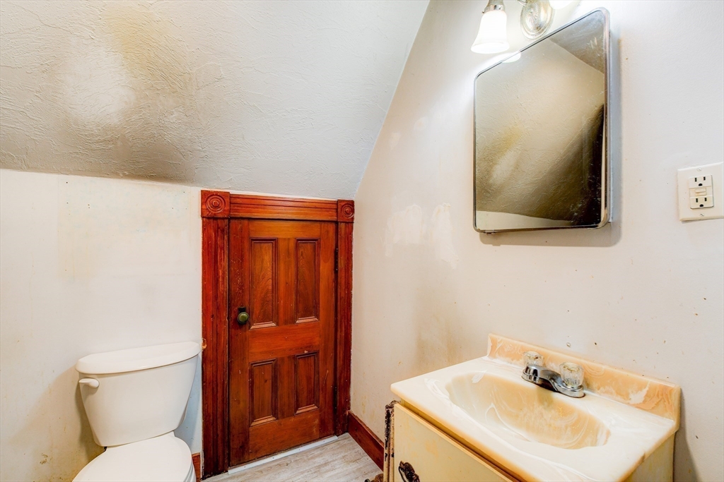 120 Graham Street Gardner, MA 01440 - Photo 32 of 37 a bathroom with a toilet sink and mirror