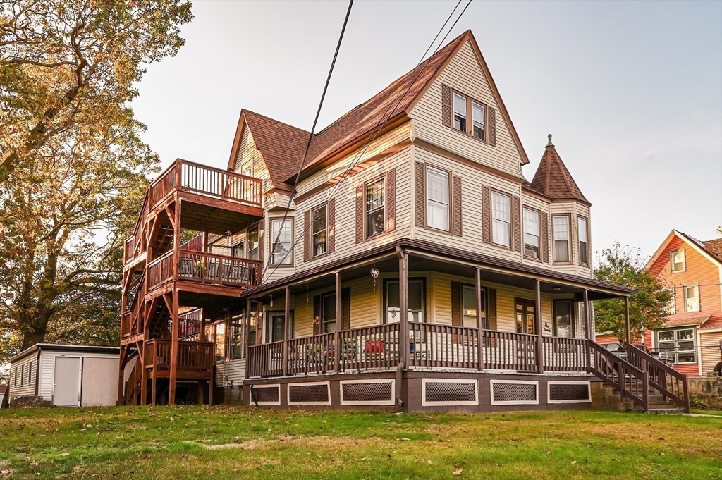 120 Graham Street Gardner, MA 01440 - Photo 4 of 37 a front view of a residential apartment building with a yard