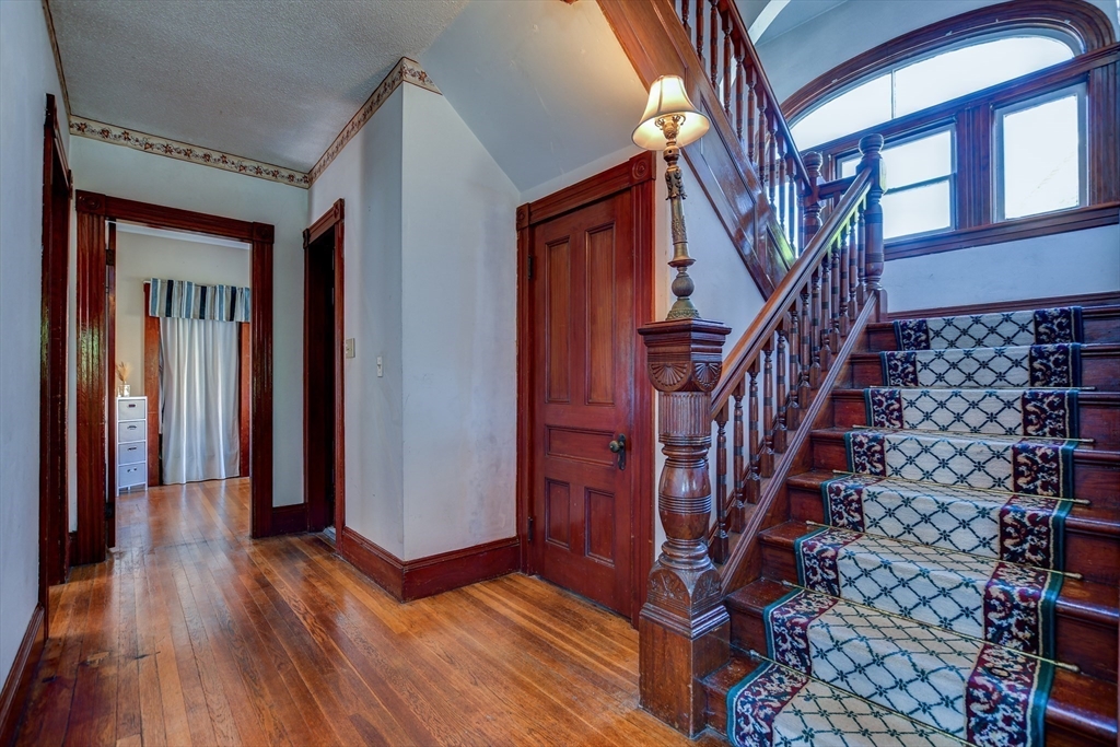 120 Graham Street Gardner, MA 01440 - Photo 8 of 37 a view of entryway with wooden floor and stairs