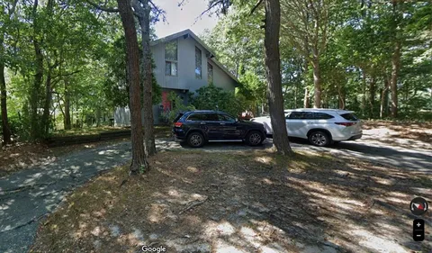 a car parked in front of a house