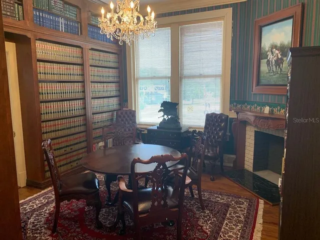 a view of a dining room with furniture and window