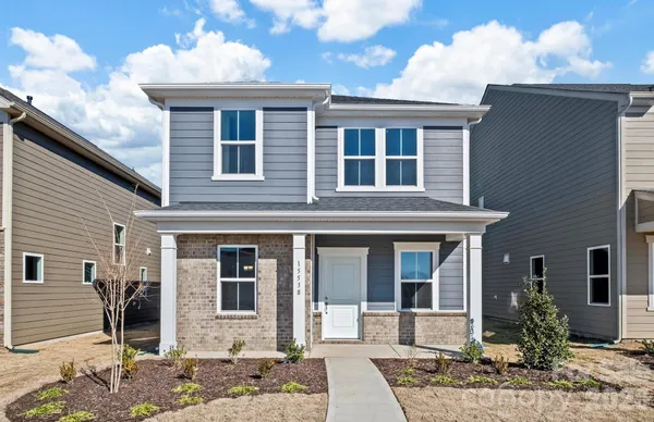 a front view of a house with a porch