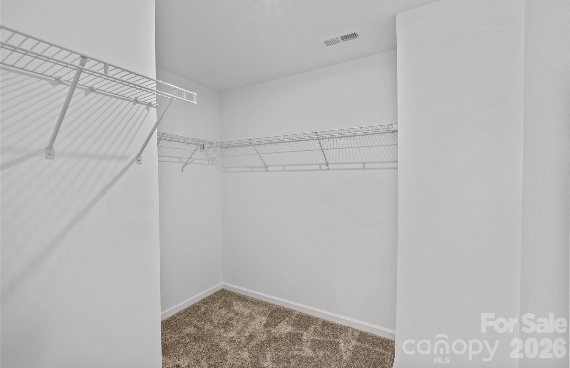 3605 Edisto Place Monroe, NC 28110 - Photo 11 of 17 a view of a room with racks on the wall