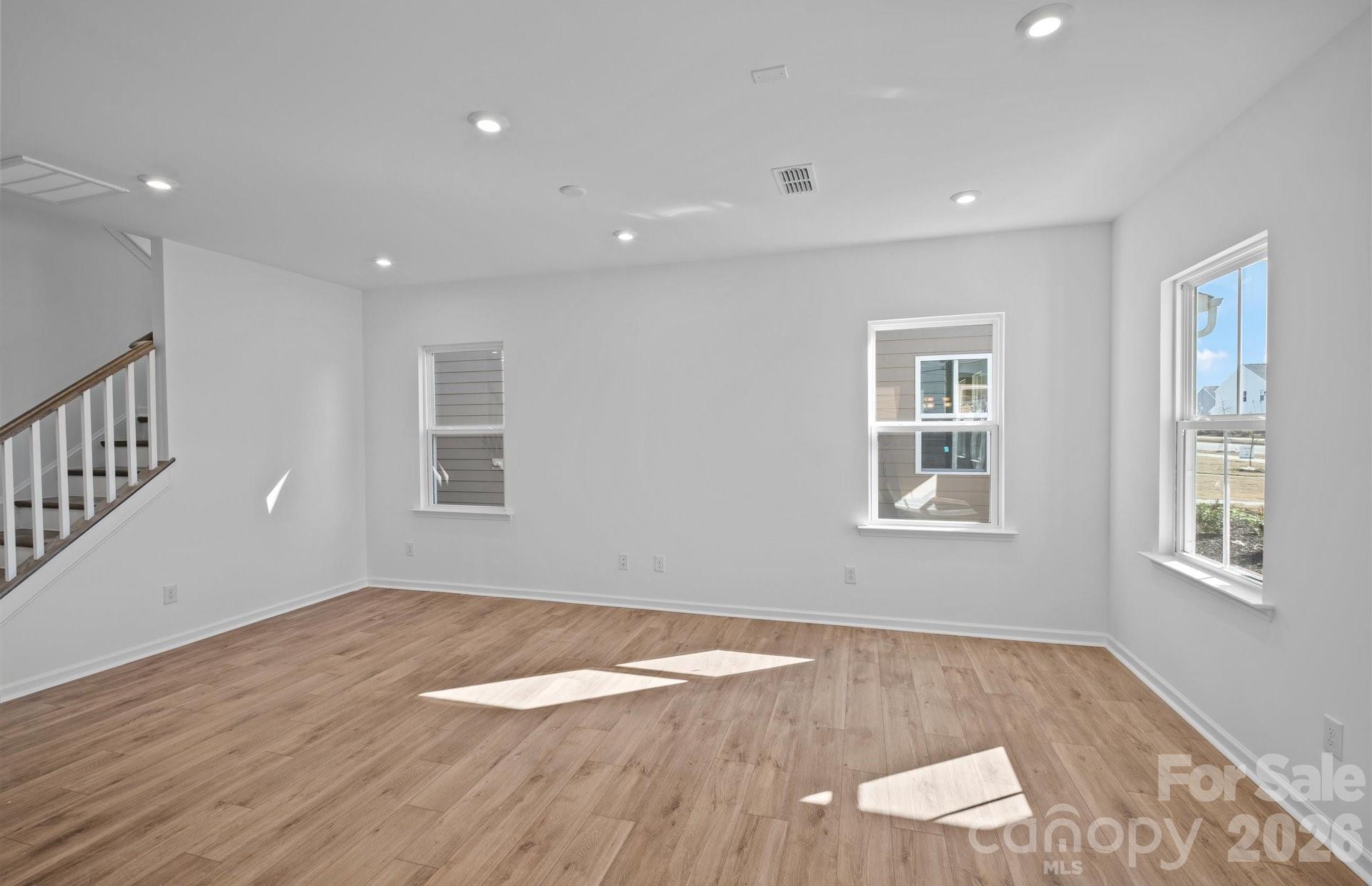 3605 Edisto Place Monroe, NC 28110 - Photo 2 of 17 a view of empty room with wooden floor and fan