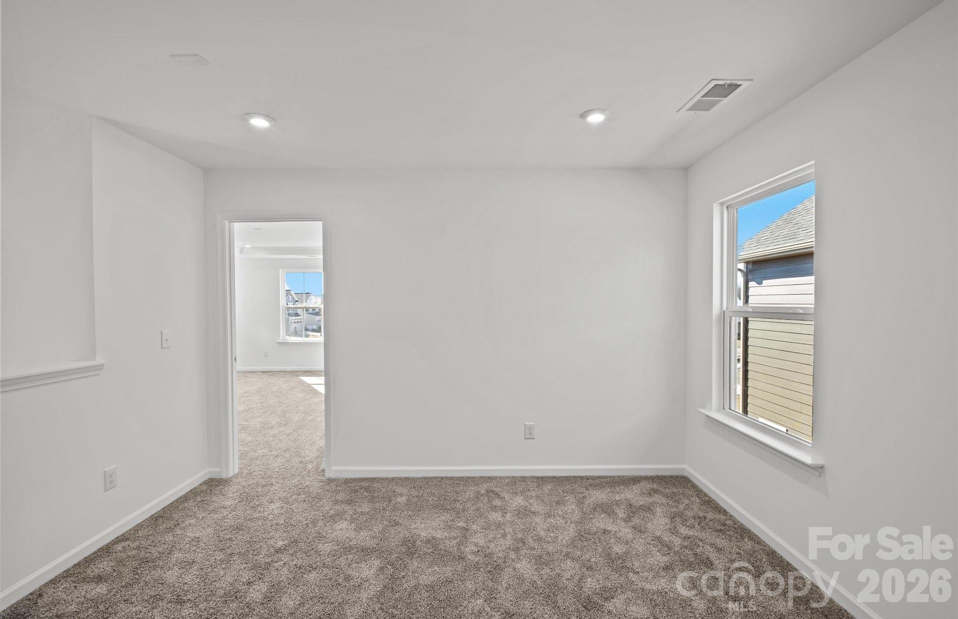 3605 Edisto Place Monroe, NC 28110 - Photo 8 of 17 a view of an empty room and a window